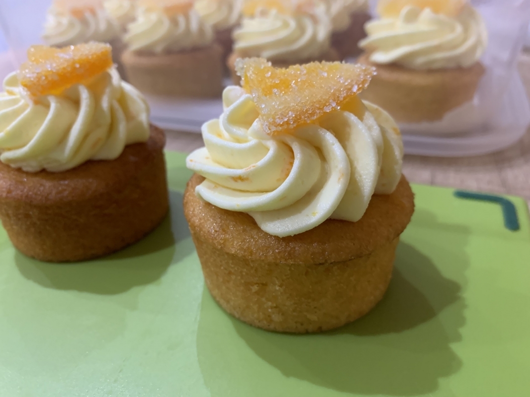 gluten-free-orange-mini-cakes-with-orange-frosting-and-candied-orange-decoration-february-2025-2.jpg